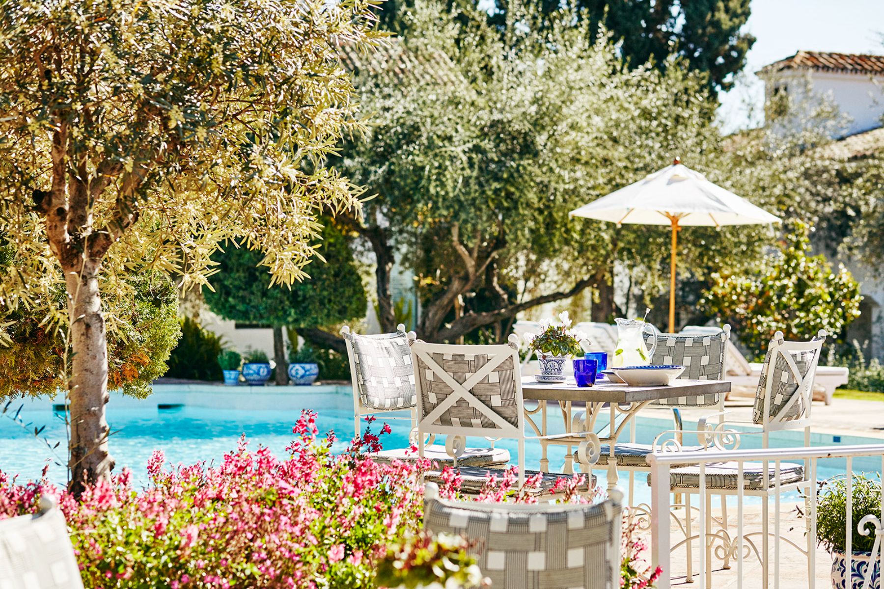 Garden pool seating area at Marbella Club in Spain