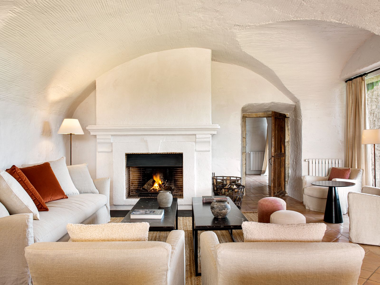 Cosy lounge area with fireplace at luxury hotel Mas de Torrent in Spain