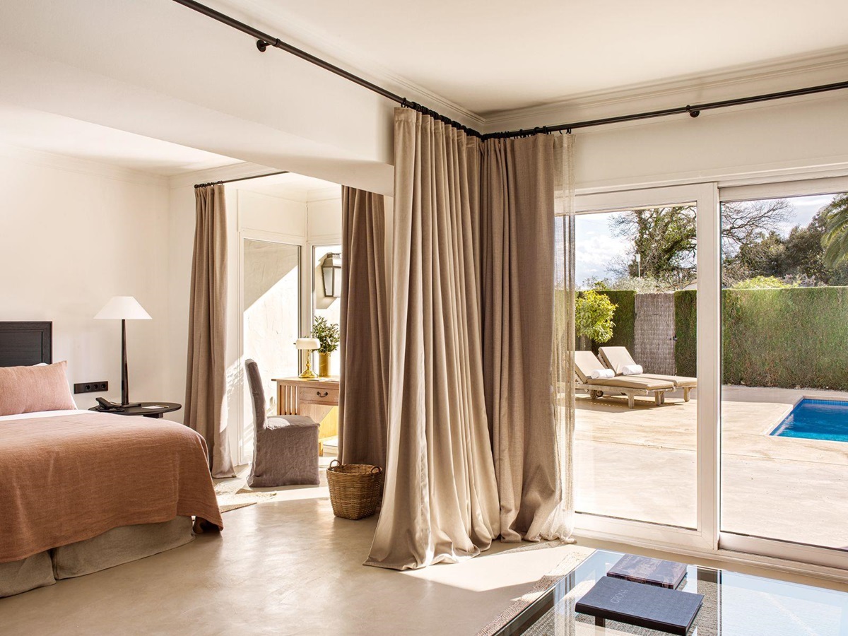 Bedroom of a pool villa with access to a private terrace with pool at luxury hotel Mas de Torrent in Spain
