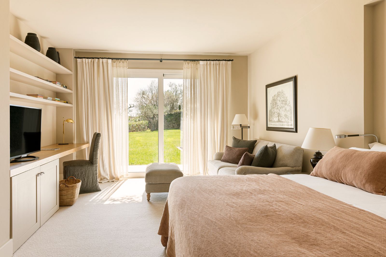 Light and airy bedroom with garden access at luxury hotel Mas de Torrent in Spain