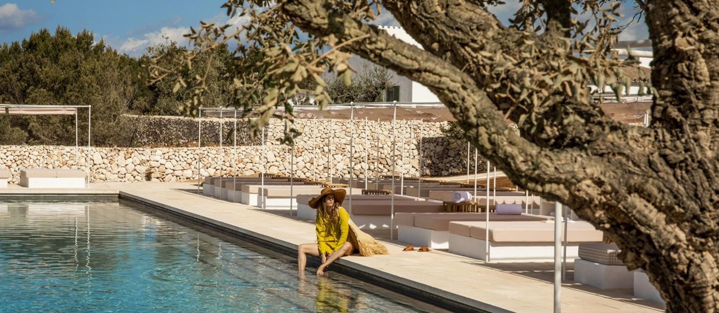 Guest enjoying the outdoor pool at the Menorca Experimental hotel
