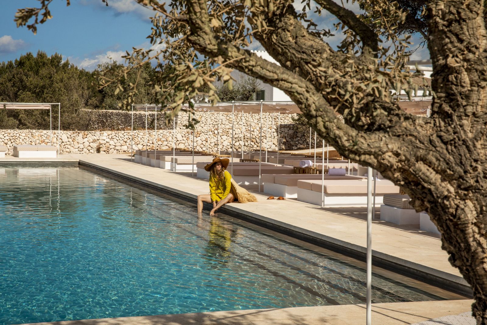 Guest enjoying the outdoor pool at the Menorca Experimental hotel