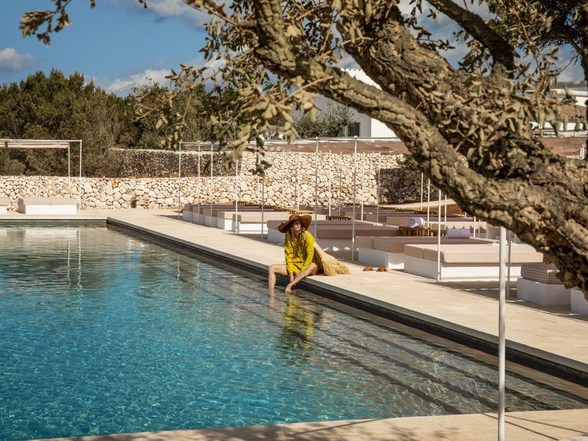Guest enjoying the outdoor pool at the Menorca Experimental hotel