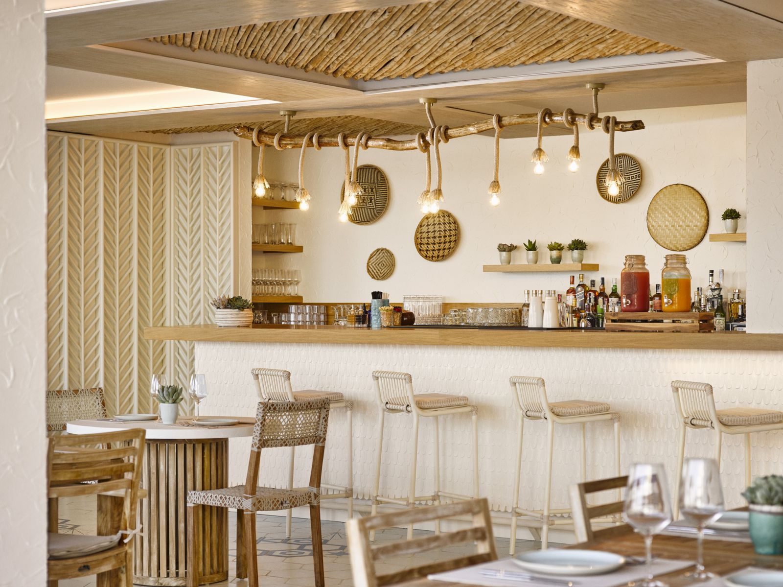 Beach-chic Chambao Bar with rustic woven seats at luxury hotel Nobu Ibiza