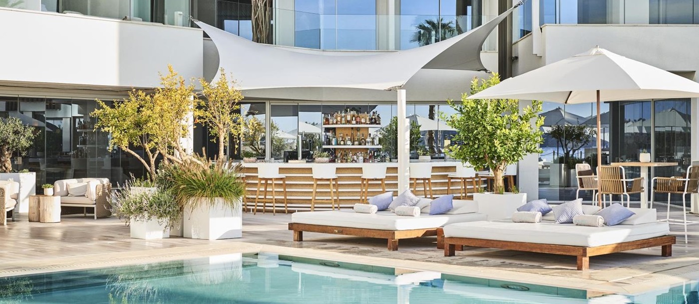 Pool Bar and sun loungers at luxury hotel Nobu Ibiza