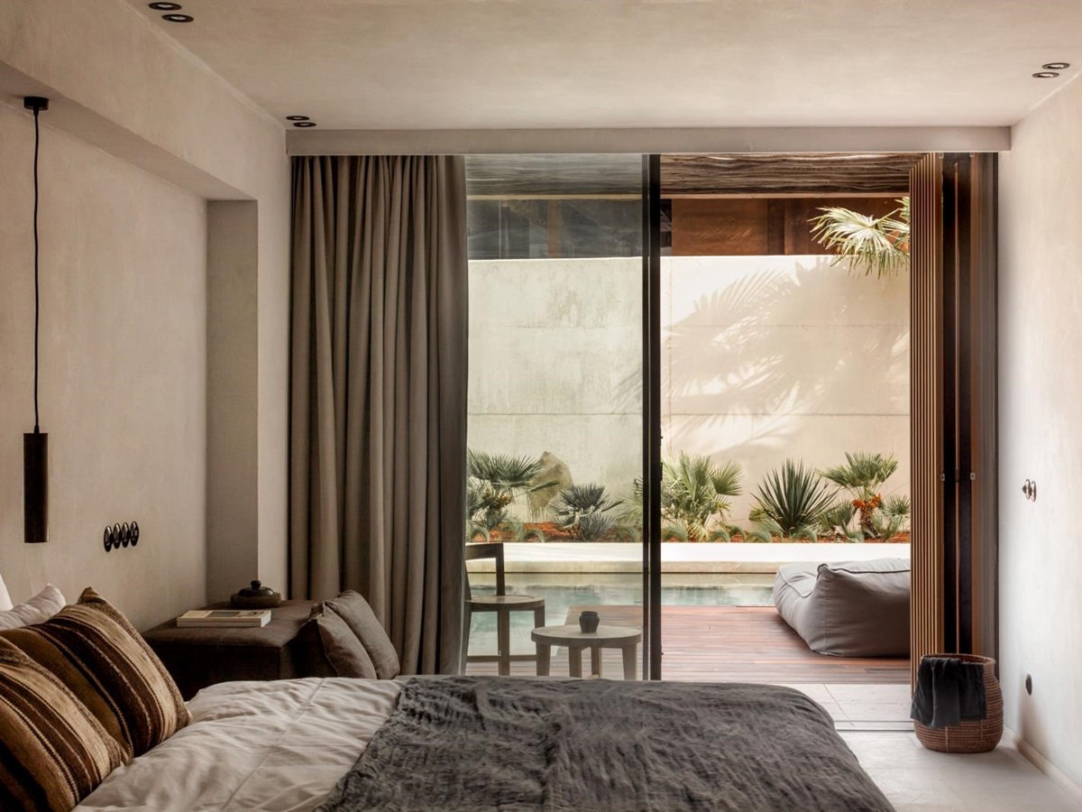Bedroom with pool access at luxury resort OKU Ibiza