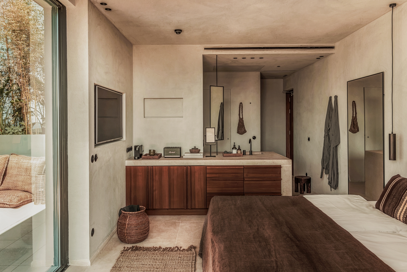 Bedroom with private terrace and open bathroom at luxury resort OKU Ibiza