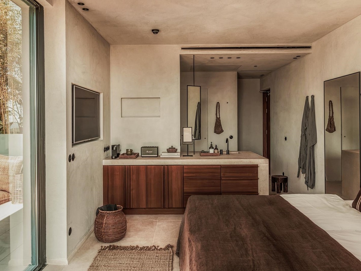 Bedroom with private terrace and open bathroom at luxury resort OKU Ibiza