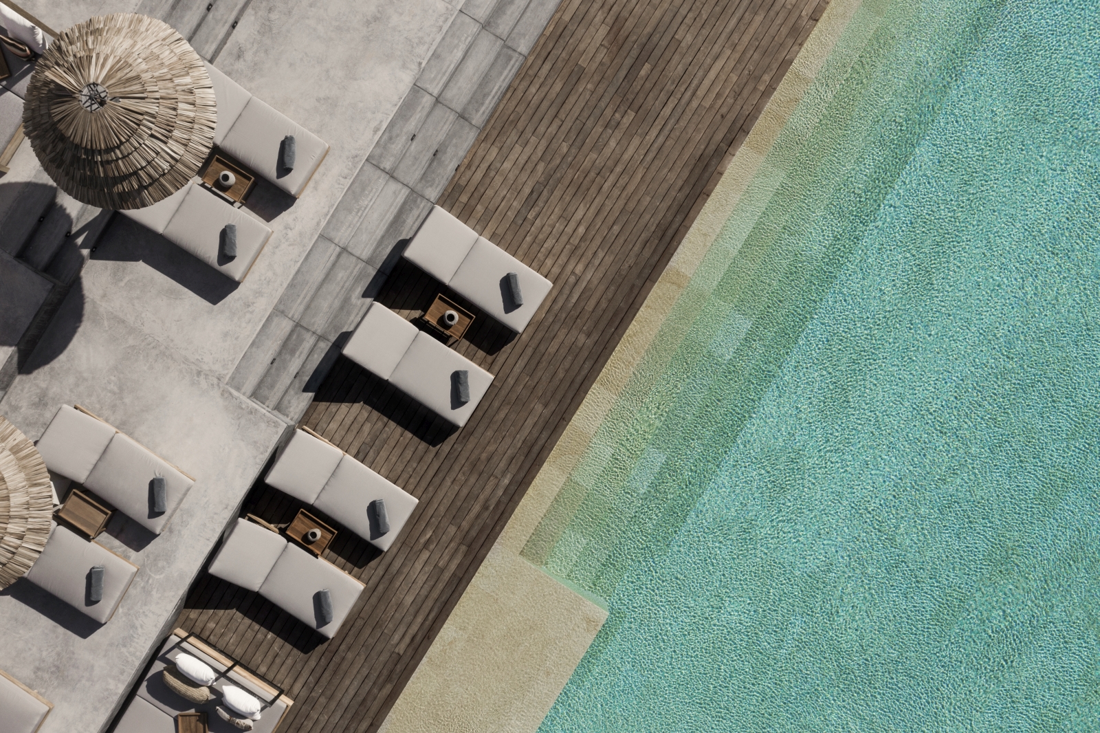 Aerial view of pool and sun loungers at luxury resort OKU Ibiza