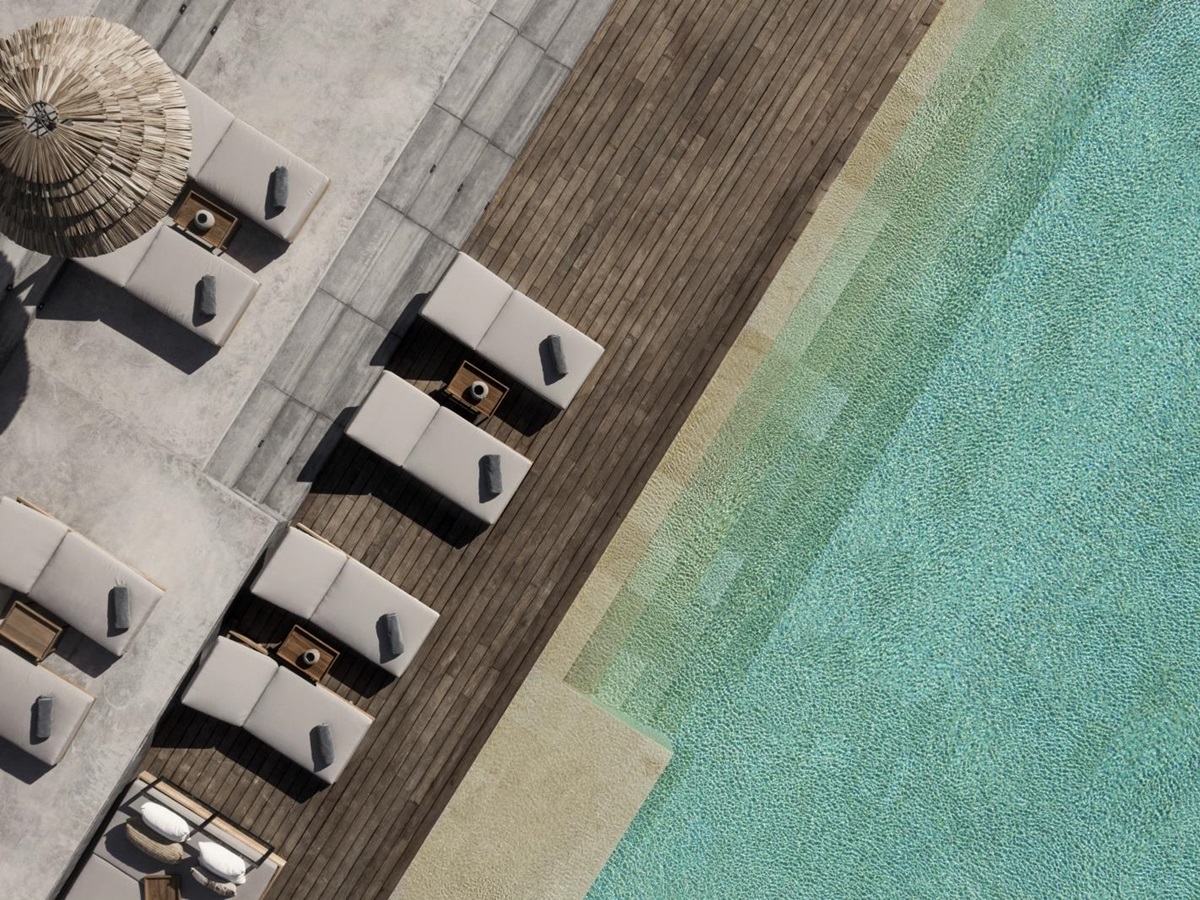 Aerial view of pool and sun loungers at luxury resort OKU Ibiza