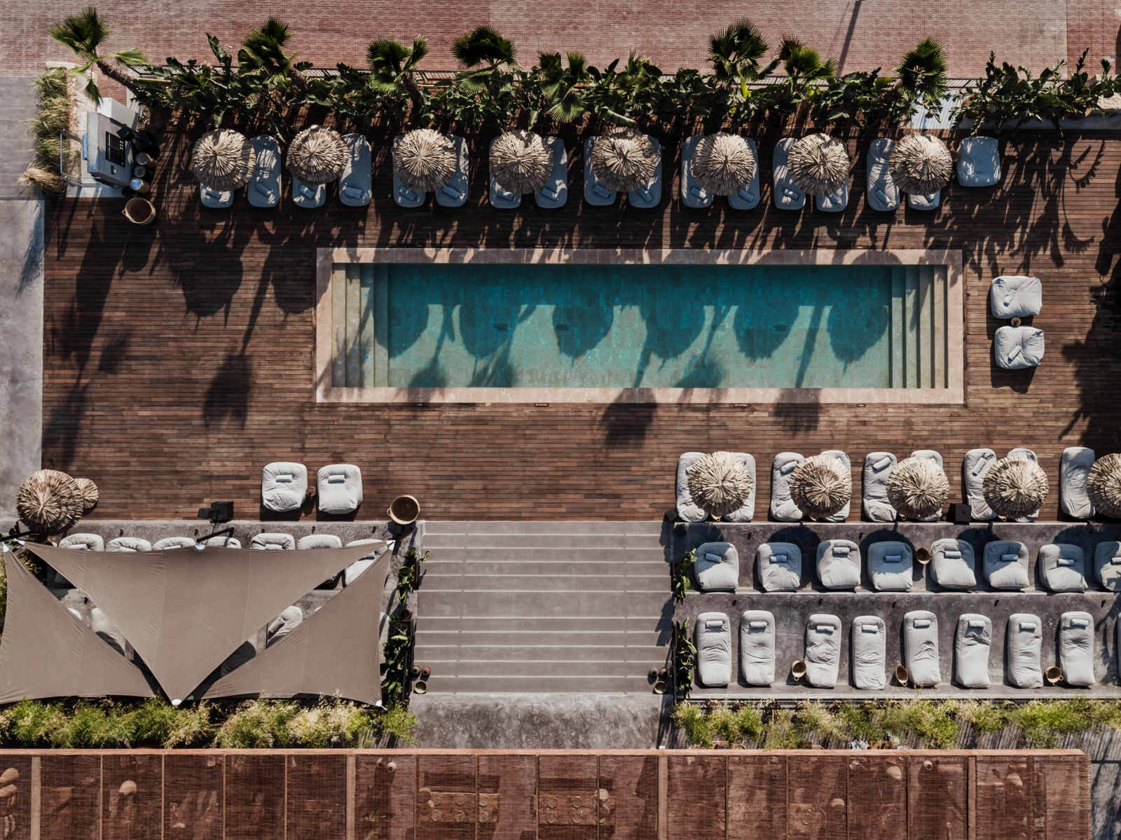Aerial shot of pool and sun loungers at luxury resort OKU Ibiza