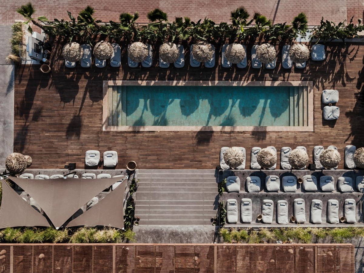 Aerial shot of pool and sun loungers at luxury resort OKU Ibiza