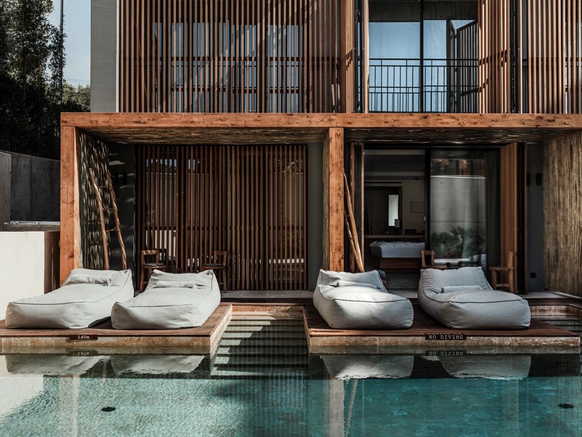 Sun loungers by the pool at luxury resort OKU Ibiza