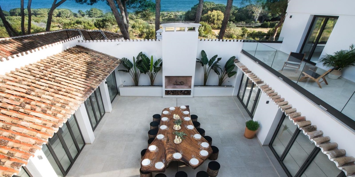 View of the terrace and beach at Villa Artola, near Marbella