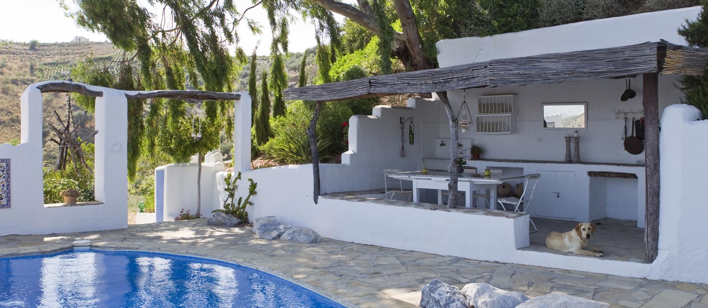 The swimming pool and the summer house of El Cortijo, Andalucia