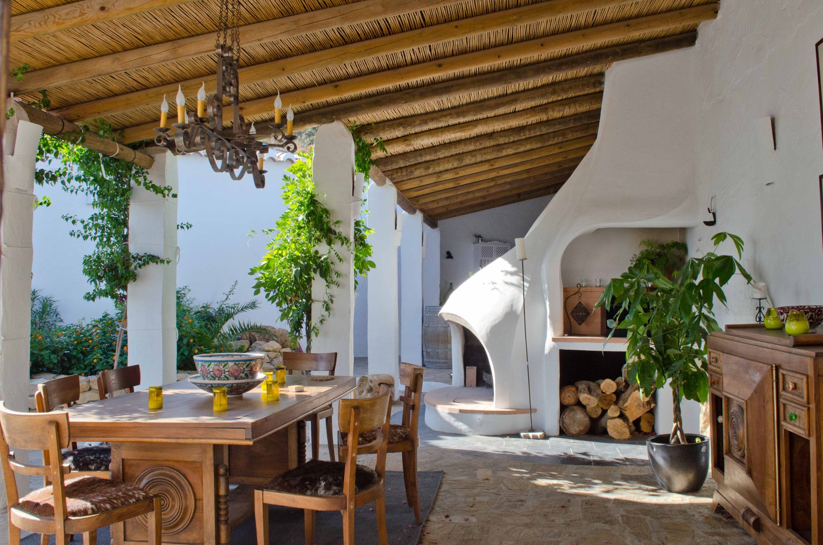 Barbecue area with outdoor dining table at luxury villa El Refugio in Andalucia, Spain