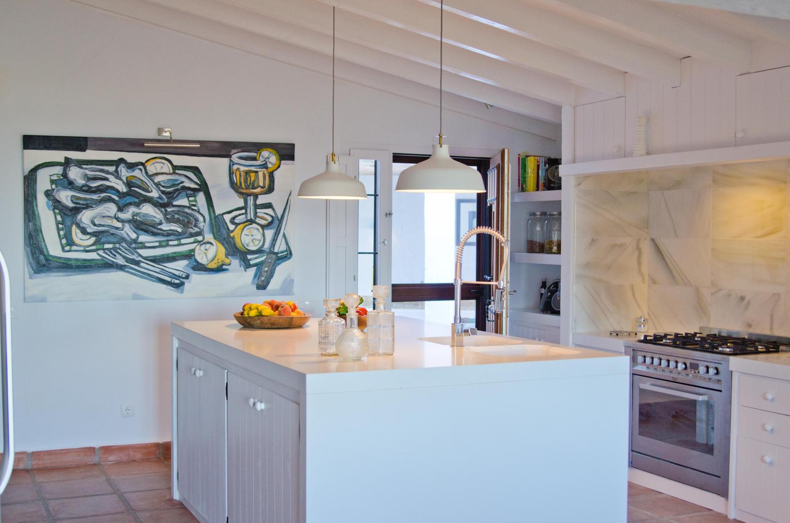 Kitchen with art in El Refugio, Andalucia
