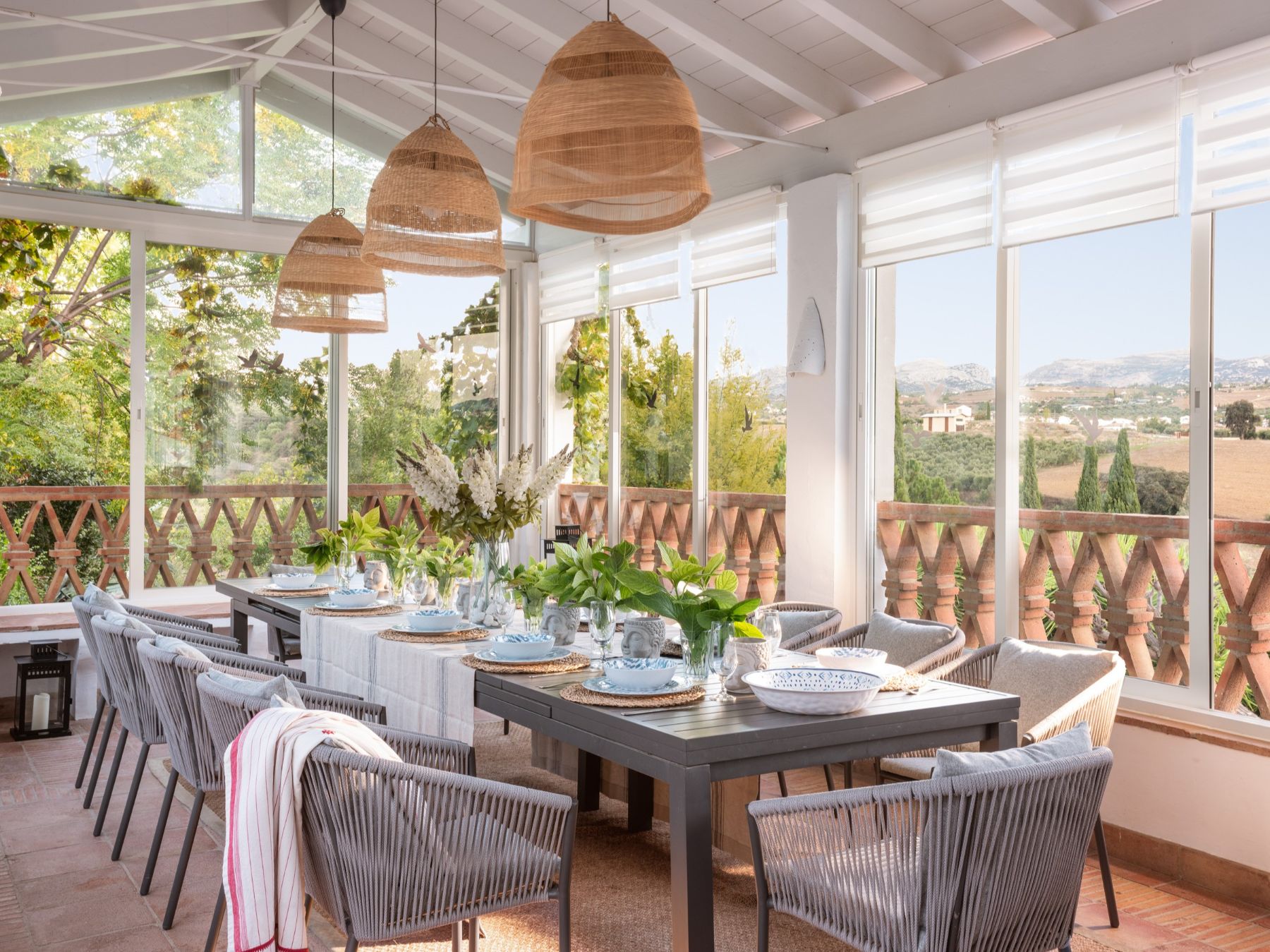 Glass-enclosed dining room at Finca Flores, Andalucia