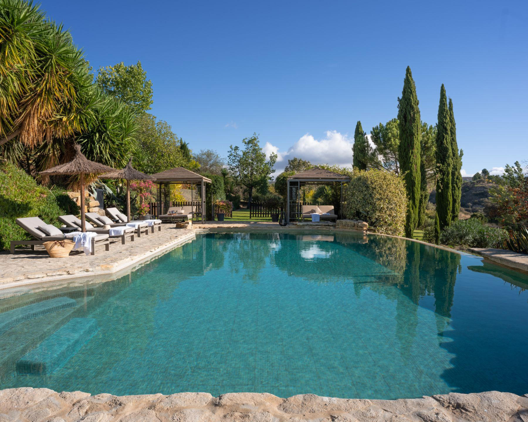 Pool and sun loungers at Finca Flores, Andalucia