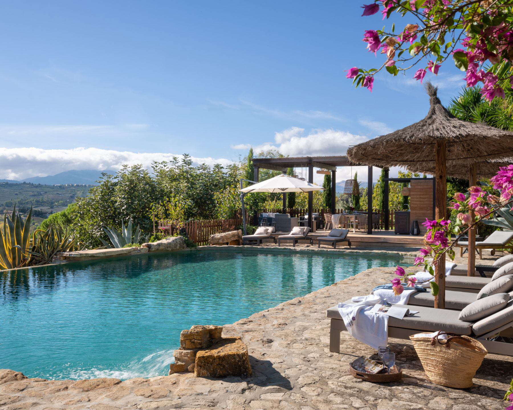 Pool with sun loungers at Finca Flores, Andalucia