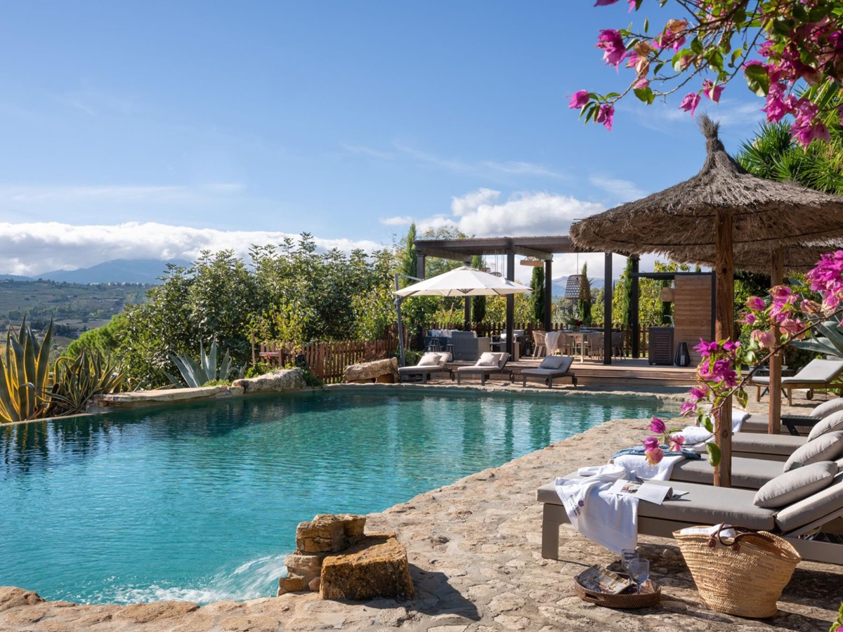 Pool with sun loungers at Finca Flores, Andalucia