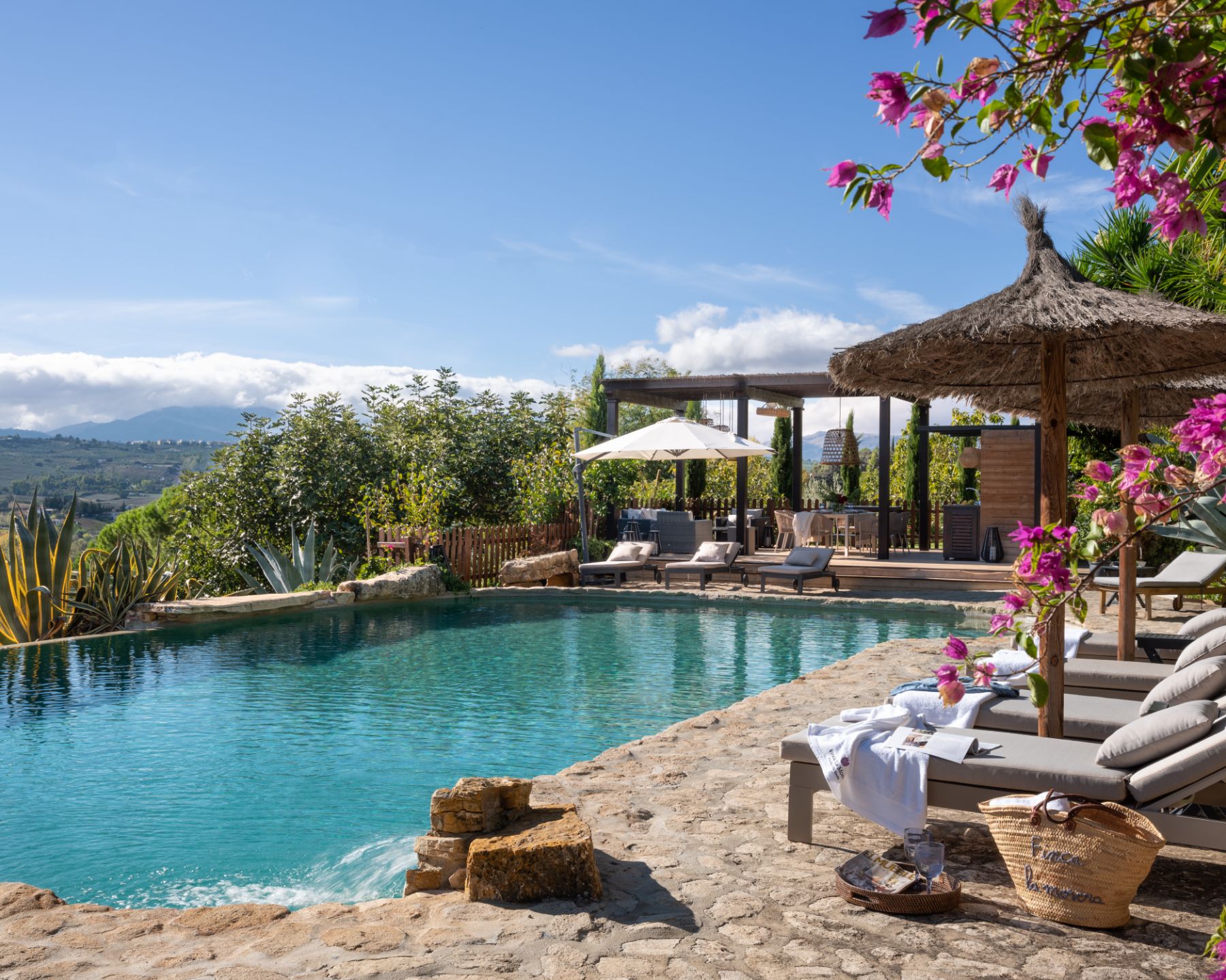 Pool with sun loungers at Finca Flores, Andalucia