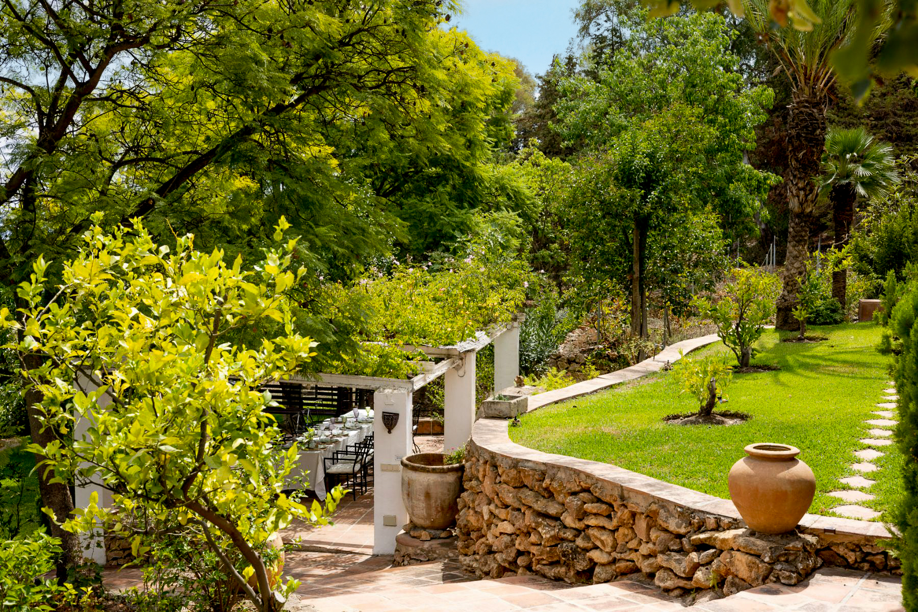 Garden and dining terrace at Finca Jardin Bonito, Andalucia