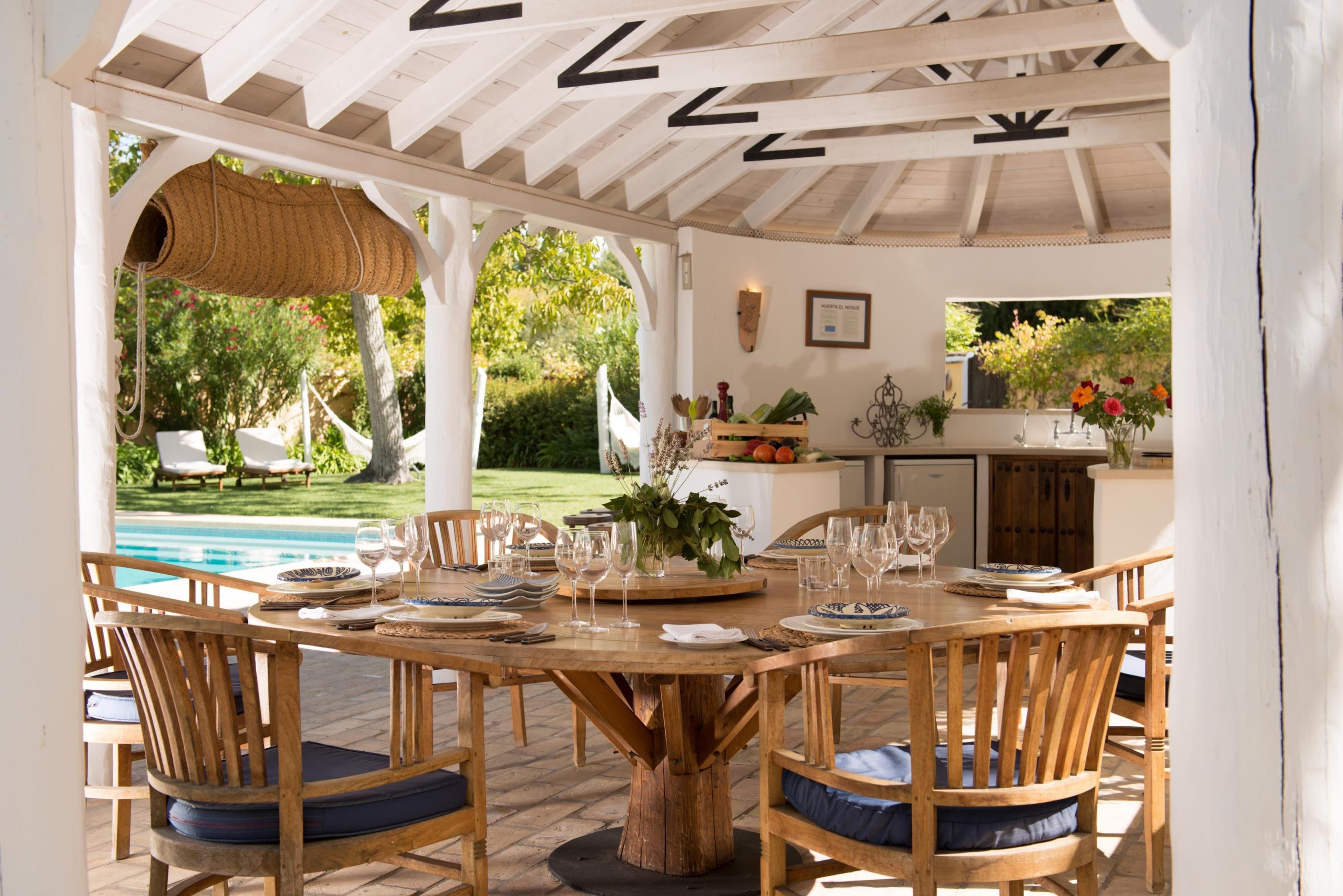 dining table at the swimming pool of la huerta el noque, andalucia