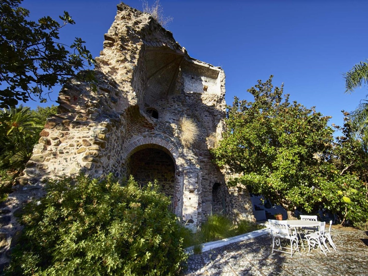 Patio and dining area by ancient ruins at Torre de Tramores in Andalucía, Spain