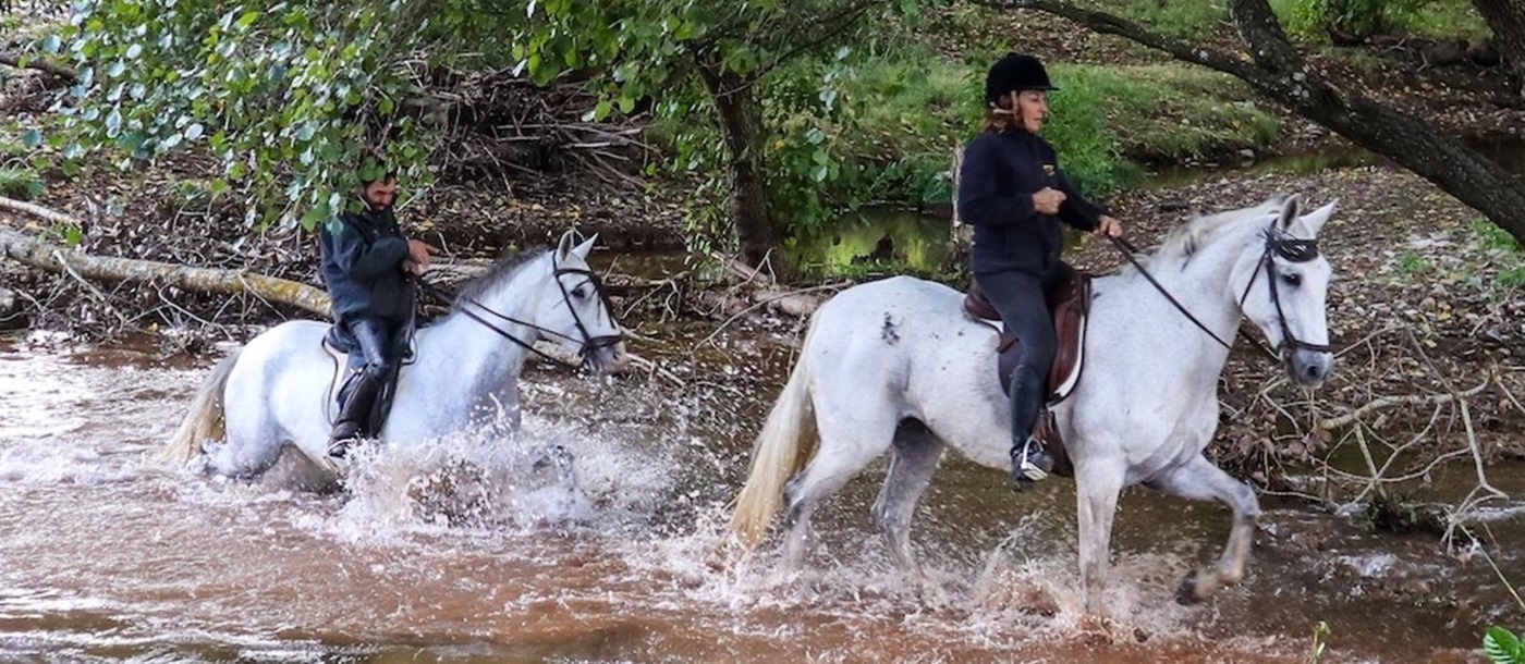Riding through water in Andalucia in Spain