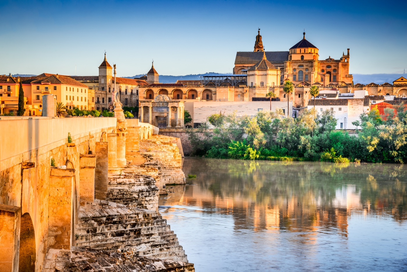 Roman bridge and great Mosque over water in Cordoba Spain