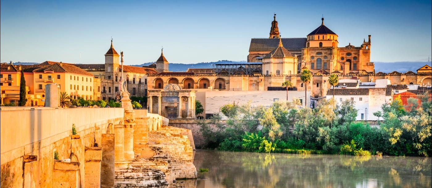 Roman bridge and great Mosque over water in Cordoba Spain