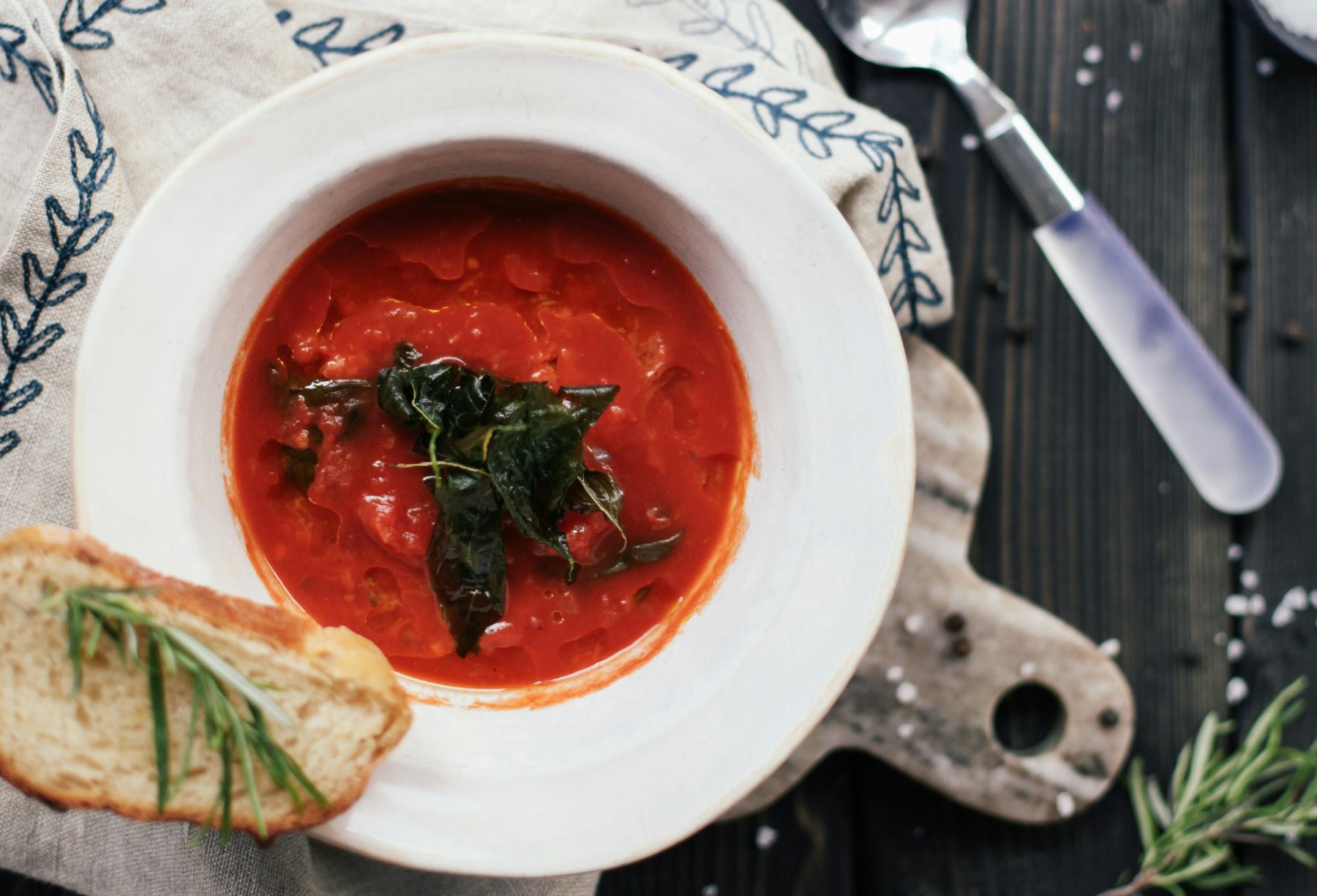 Bowl of gazpacho Spanish tomato soup with a slice of crusty bread