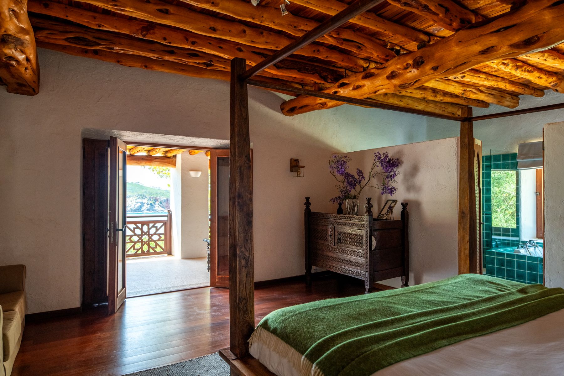 Bedroom with four poster bed at Casa Sabena, Ibiza