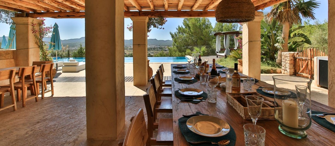 the outside dining table at the villa
