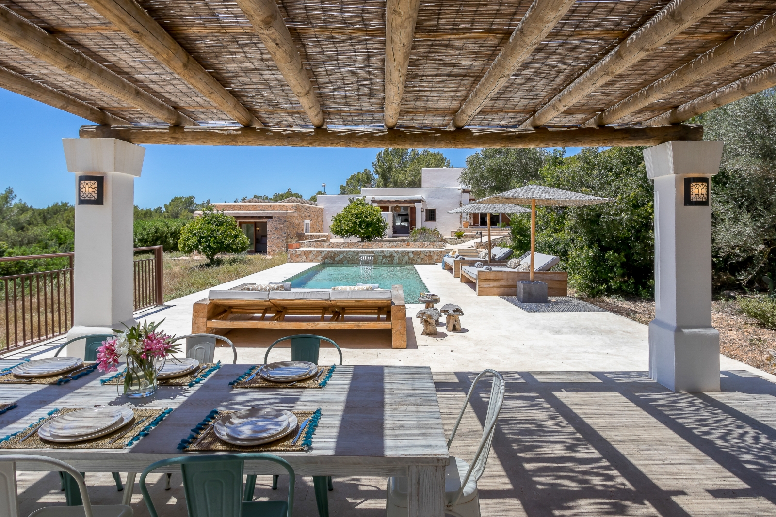 outdoor dining by the pool at Finca Natura
