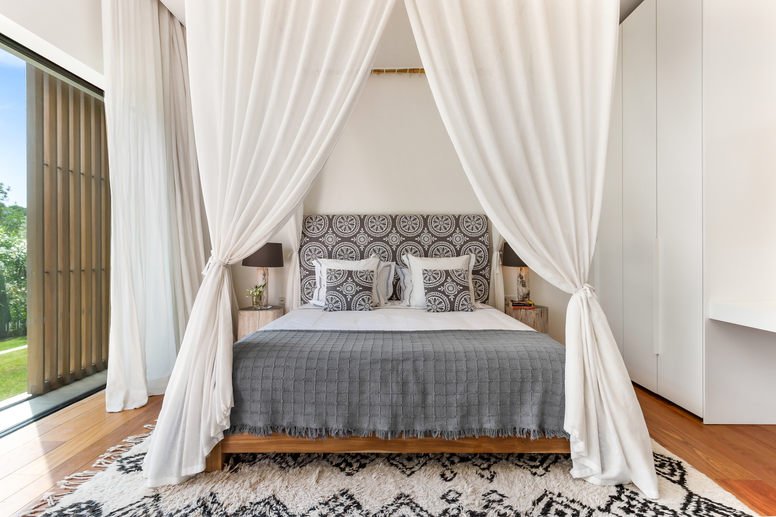 Lightflooded bedroom with Four poster bed