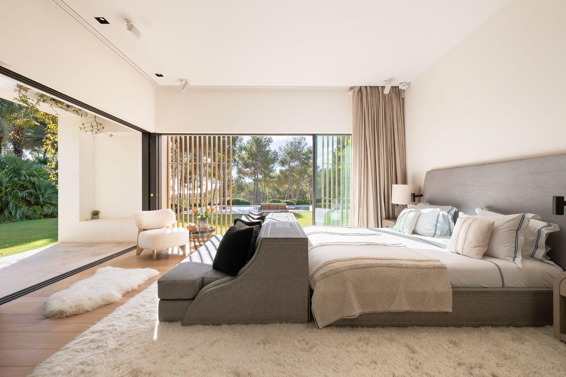 Master bedroom with garden views at Villa Xi, Ibiza