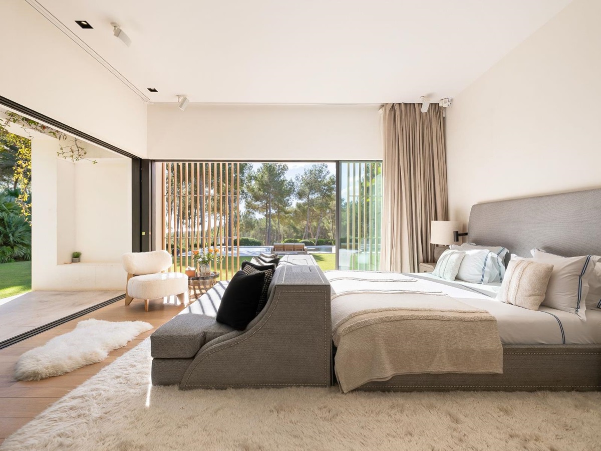 Master bedroom with garden views at Villa Xi, Ibiza