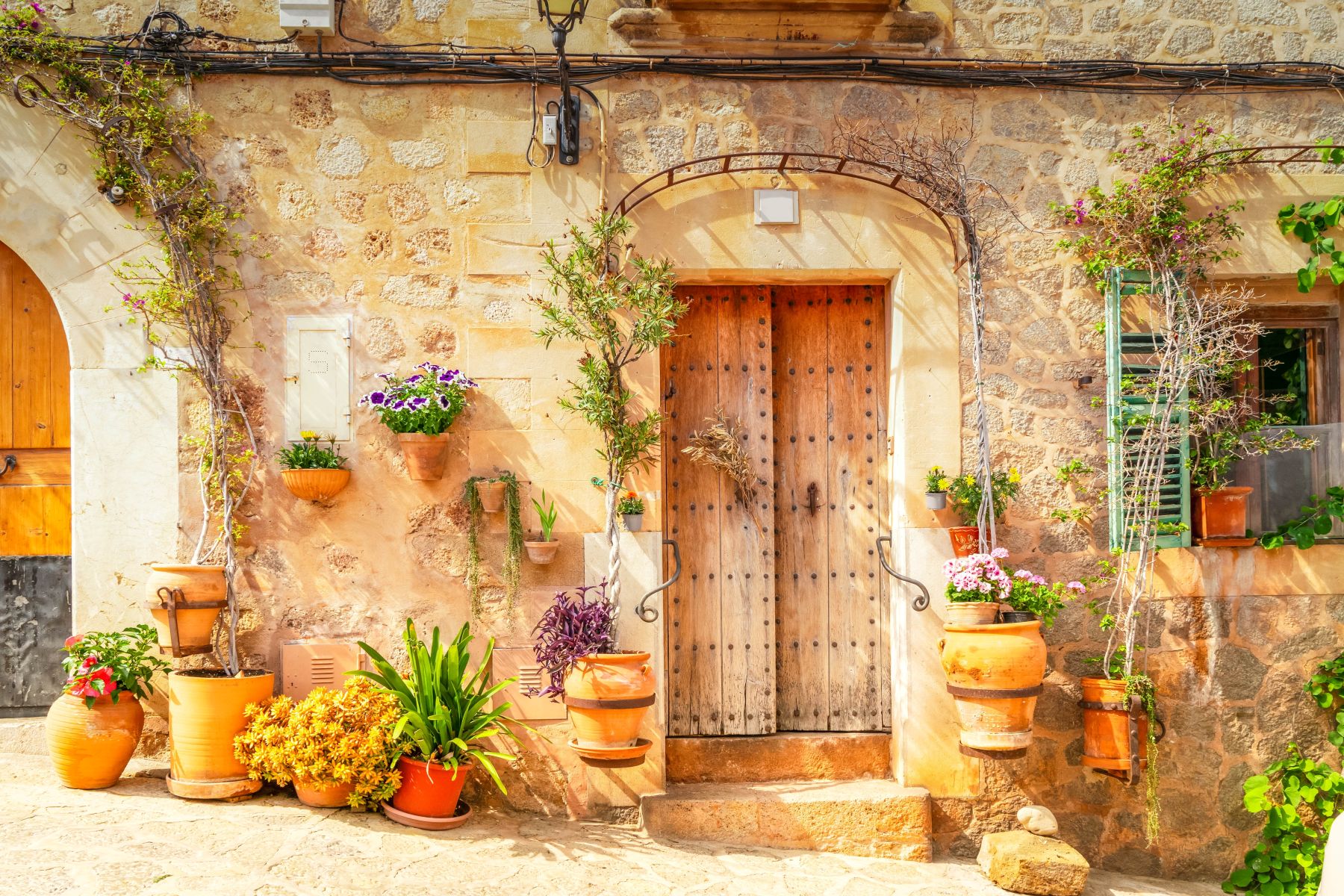 Quaint doorway with pots and plants in Mallorca
