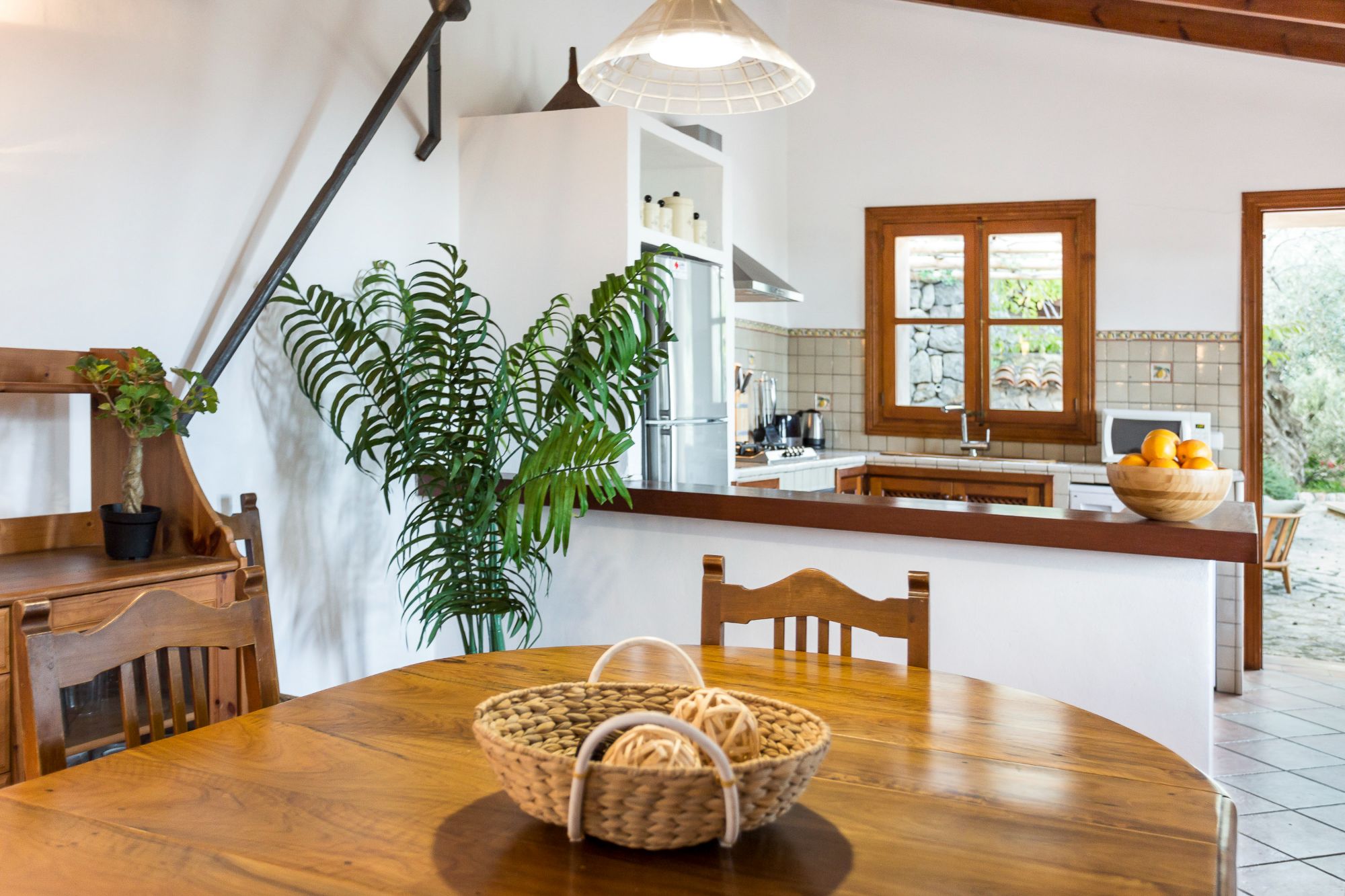 Dining area and kitchen at Can Olivia