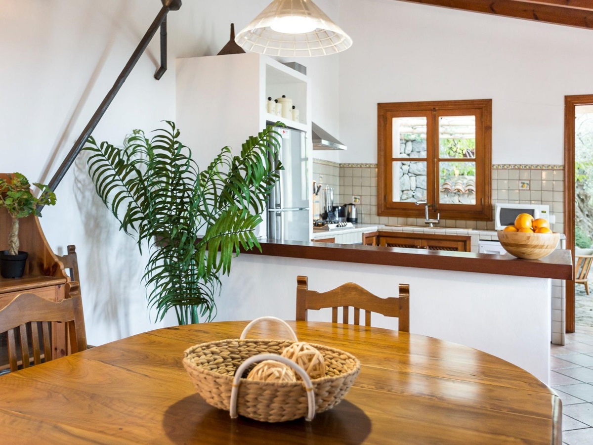 Dining area and kitchen at Can Olivia