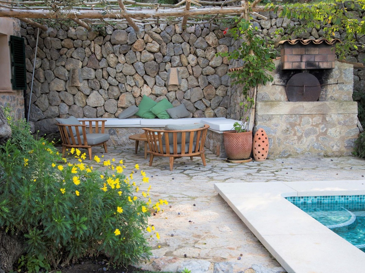 Poolside seating area at Can Olivia
