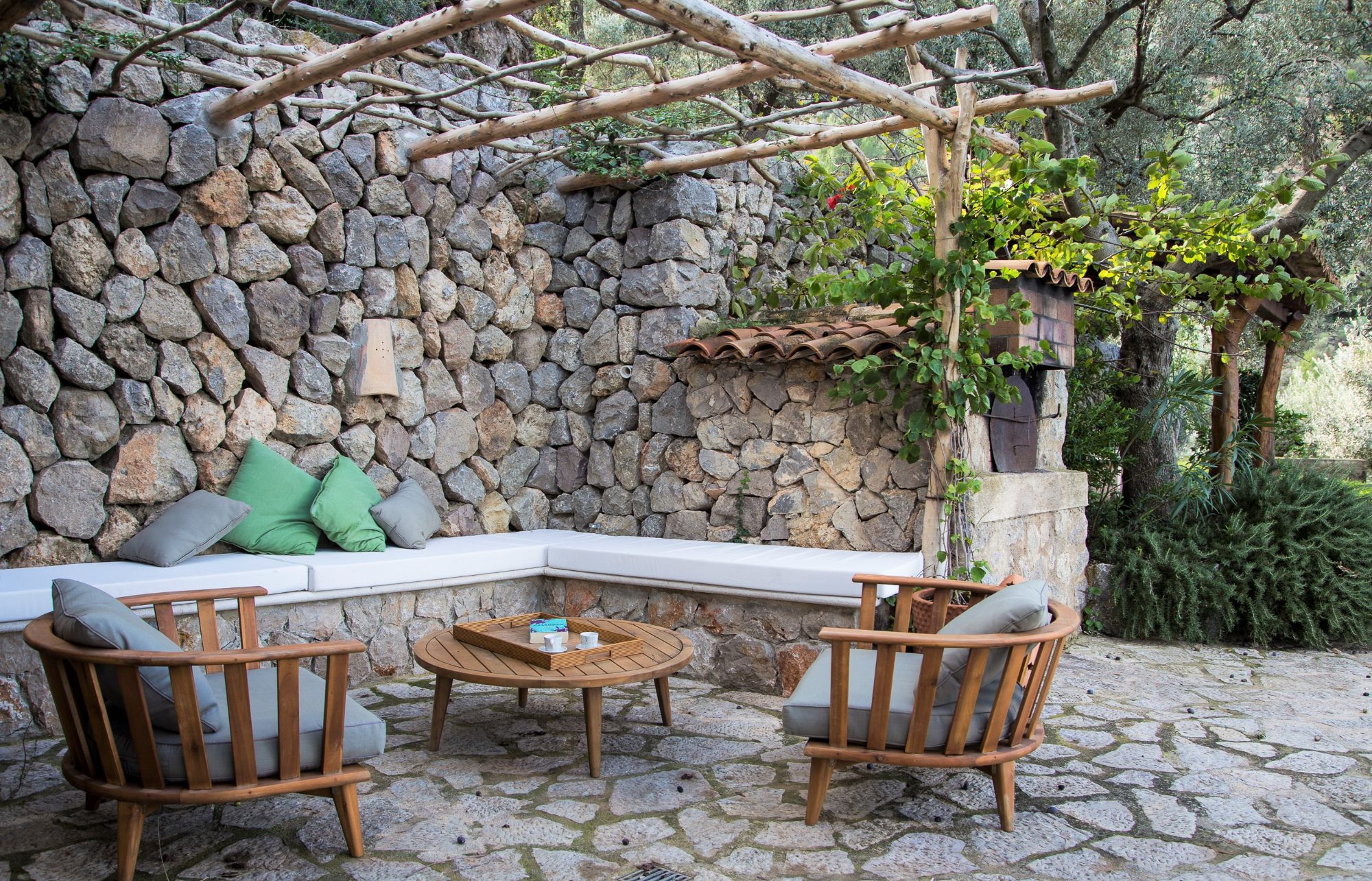 Poolside seating area at Can Olivia