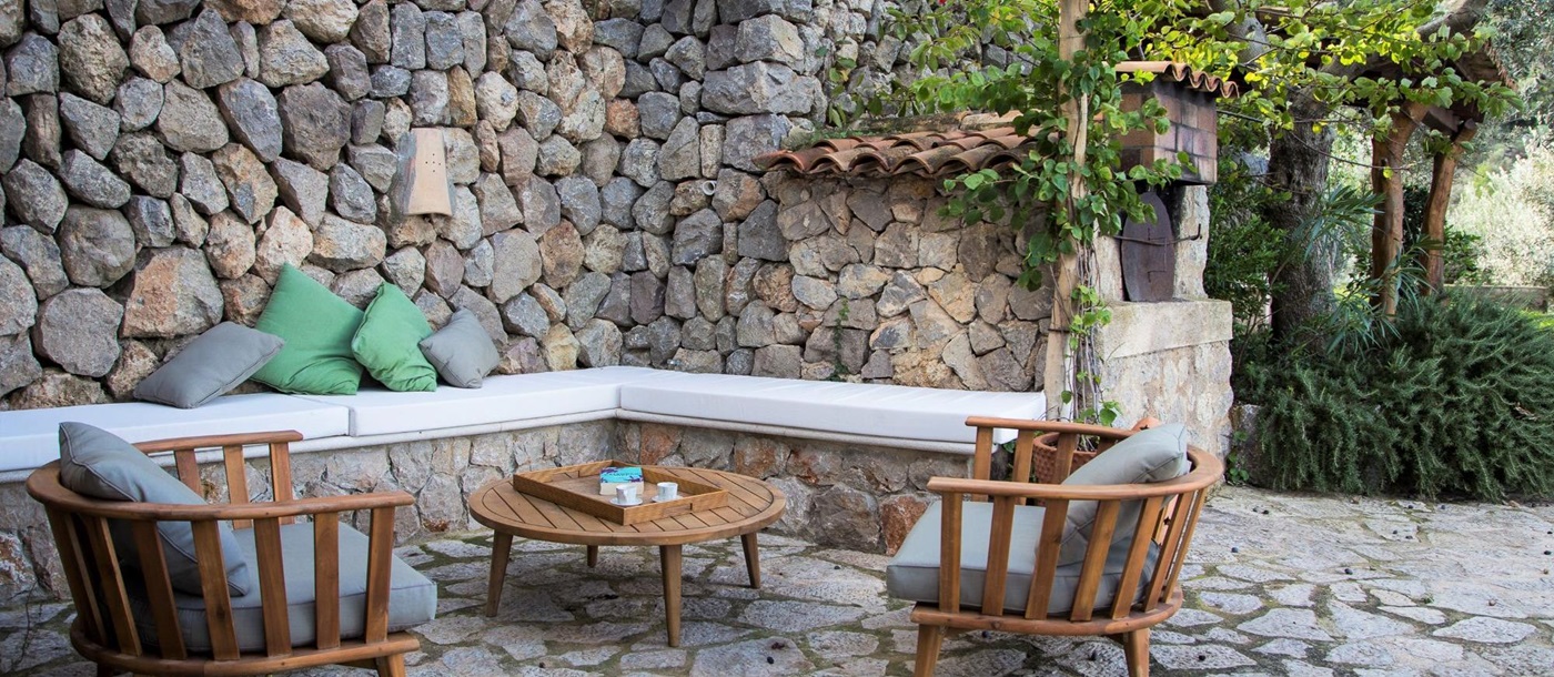 Poolside seating area at Can Olivia