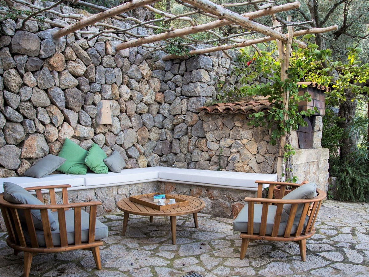 Poolside seating area at Can Olivia