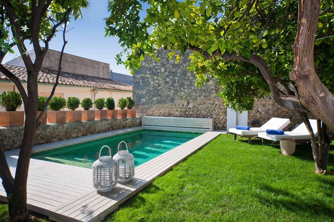 Pool and garden with loungers at Casa Blanca