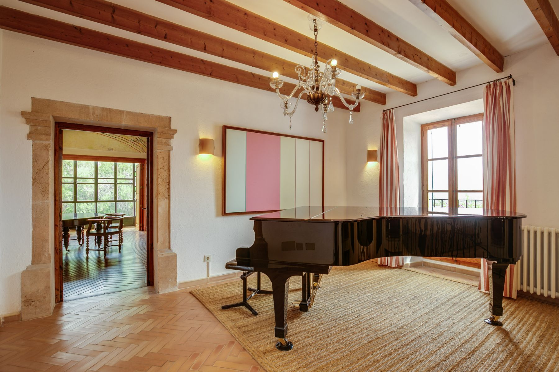 Living room with grand piano at Casa Jardin Bella, Mallorca