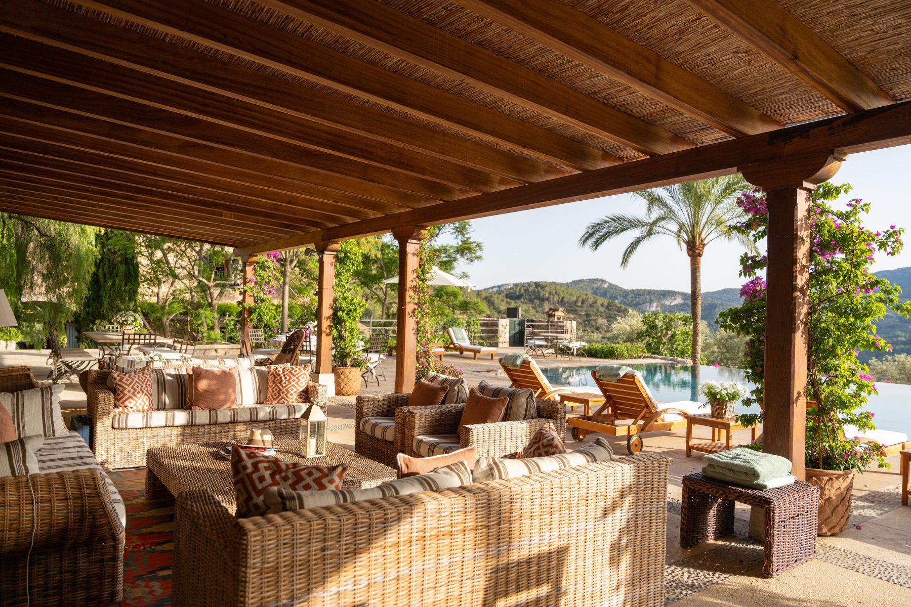 Covered pool terrace with seating at Finca Olivera, Mallorca