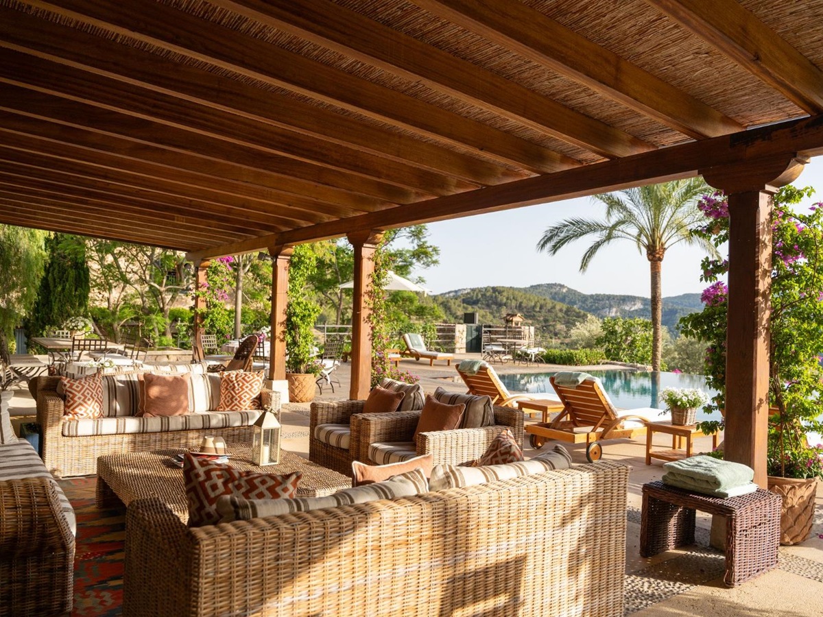 Covered pool terrace with seating at Finca Olivera, Mallorca